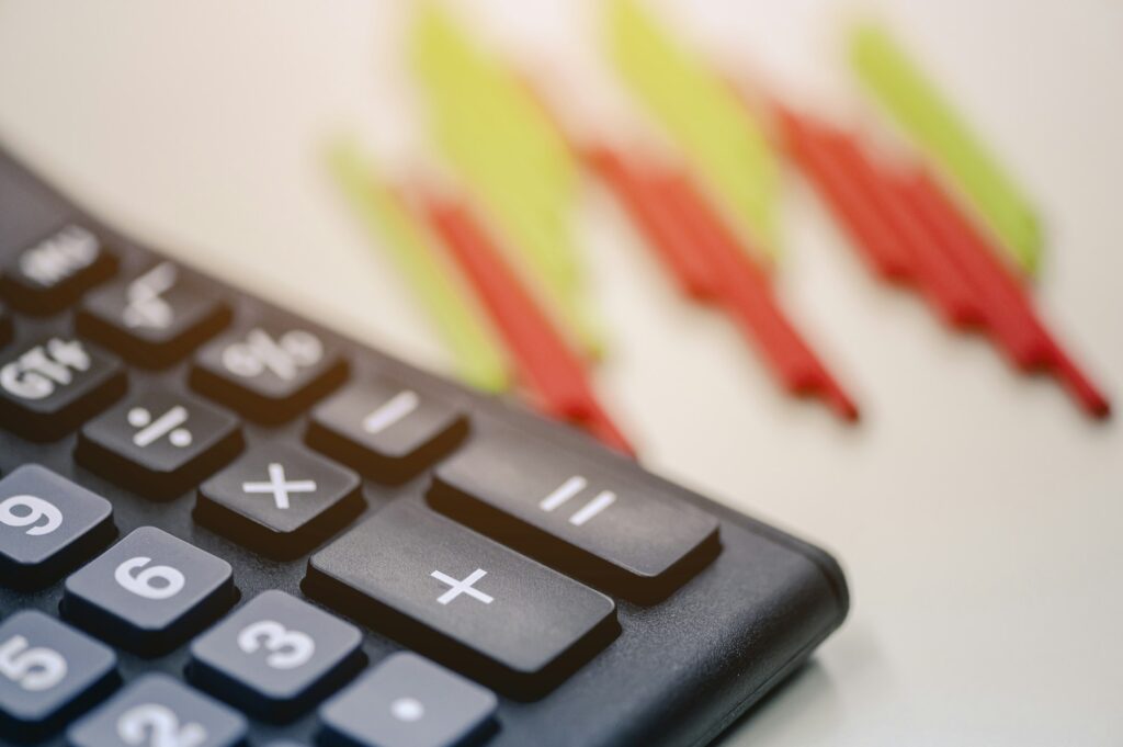 Calculator and Bar Stock graphs for analysis on investment, stock trading