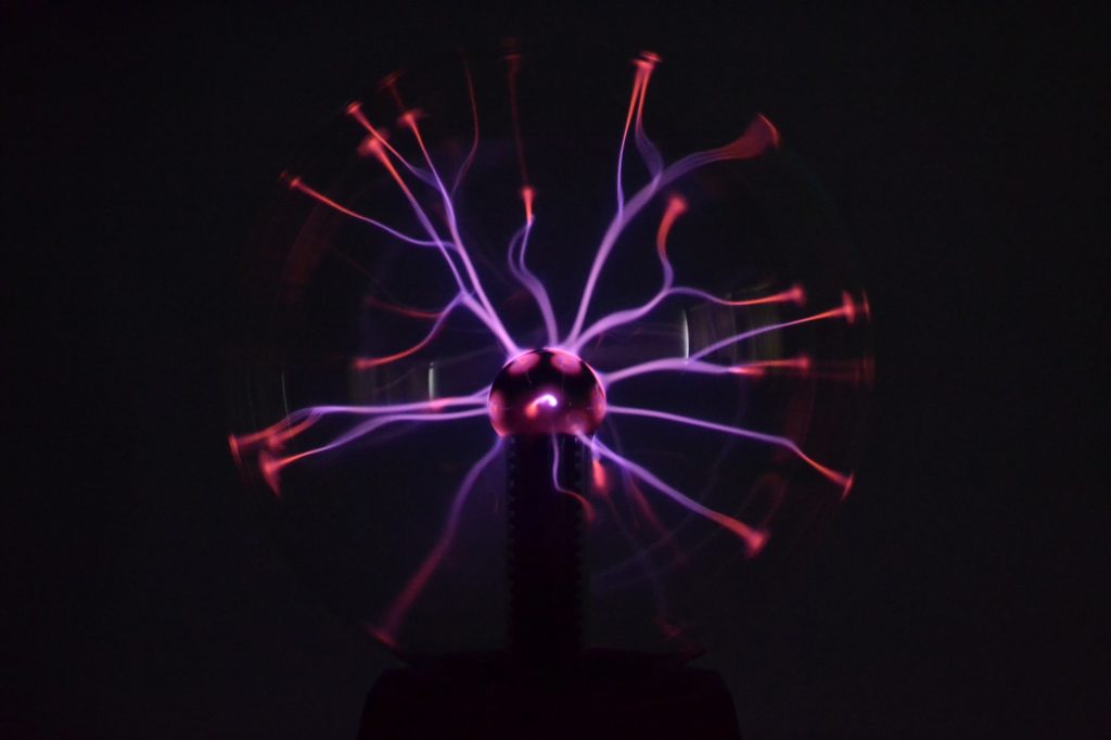 Closeup shot of a colorful plasma lamp on a black background