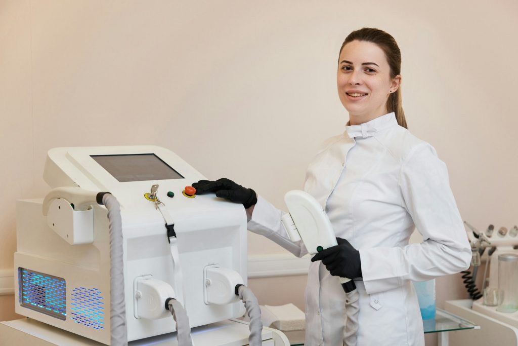cosmetologist with laser, hair removal with modern equipment