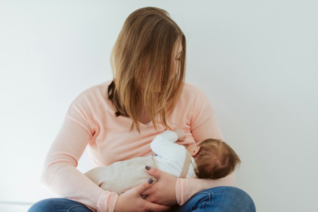 Young Mother breastfeeding newborn baby