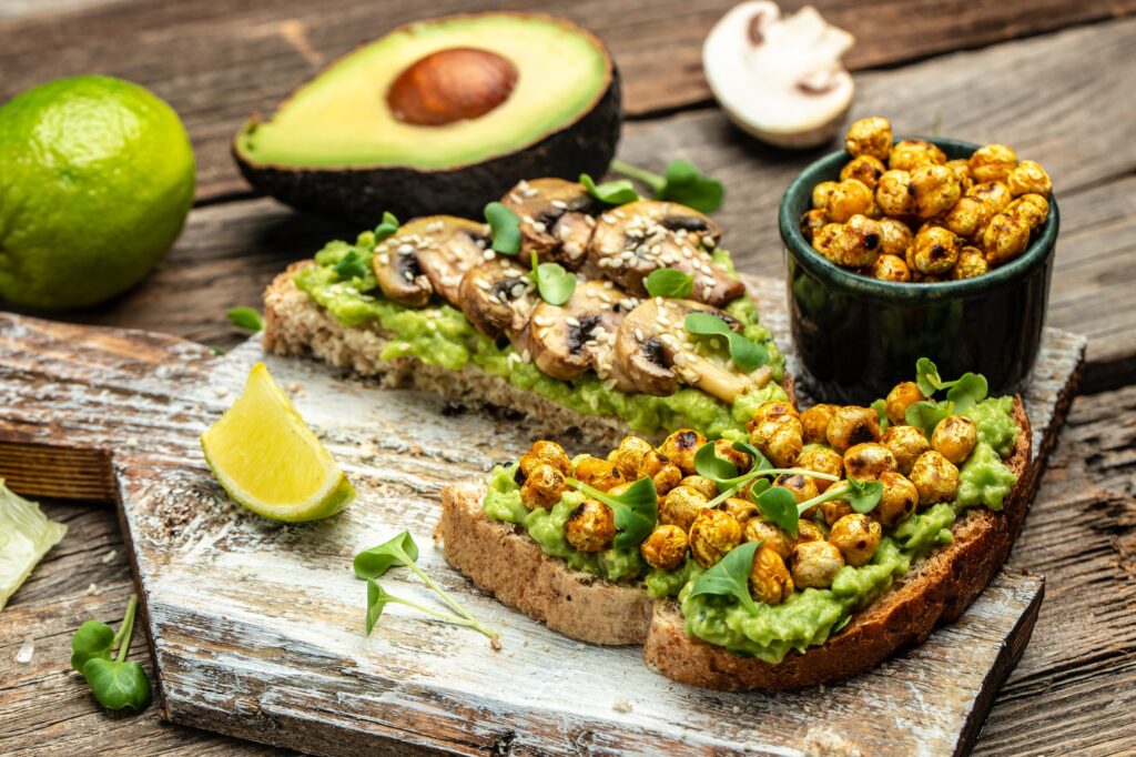 vegetarian sandwiches with avocado guacamole, chickpeas and mushrooms,