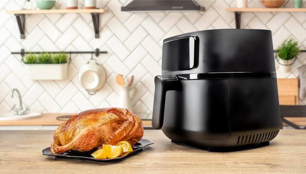 roasted whole baked duck with orange cooked in an air fryer in the kitchen