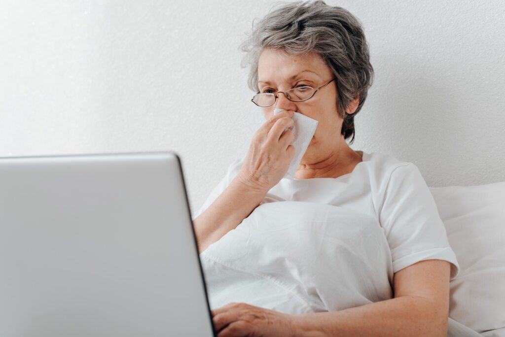 Cyberchondria, search for treatment on internet online, self-medication concept. Sick, sneezing