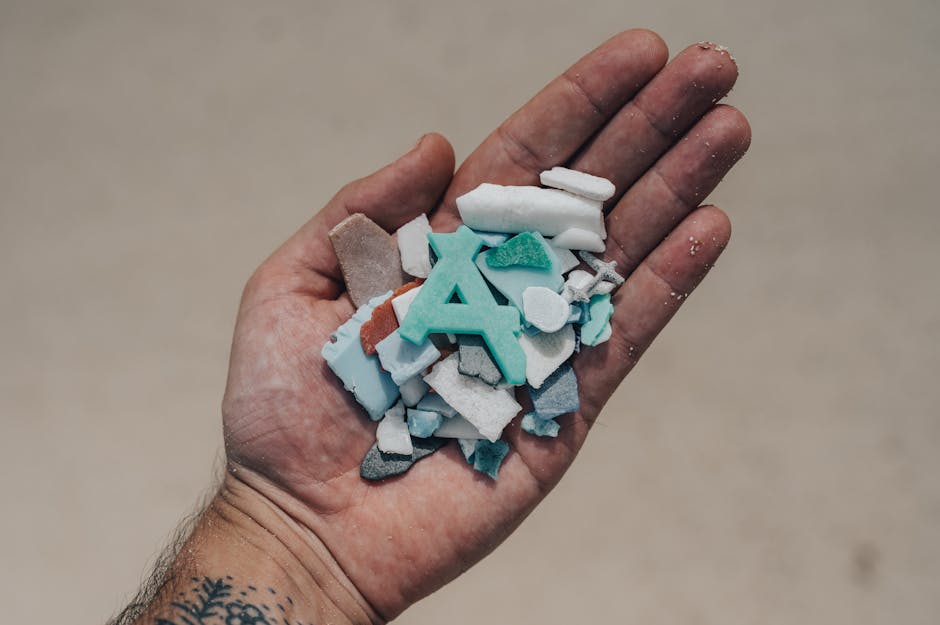Microplastics close-up on sand or water surface