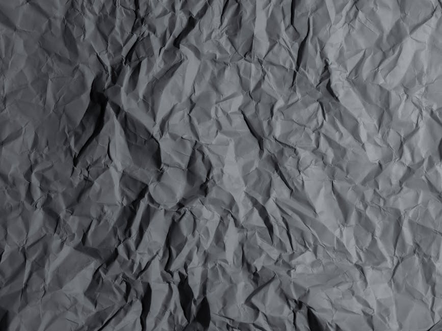 Giant sheet of paper being folded with machinery