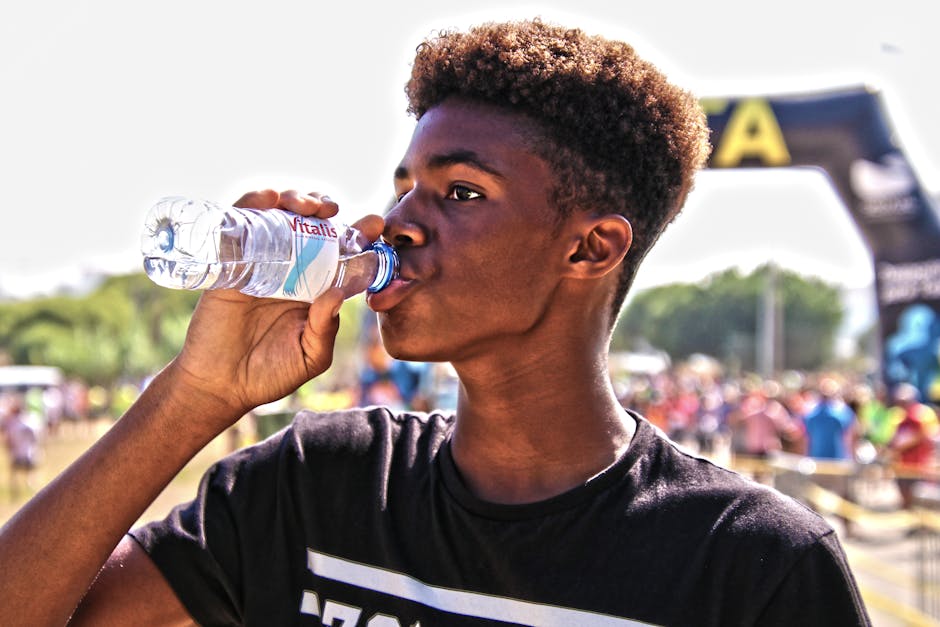 Hydration concept with water bottle and athlete after running