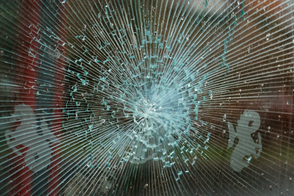 Broken glass shard close-up with sharp edges