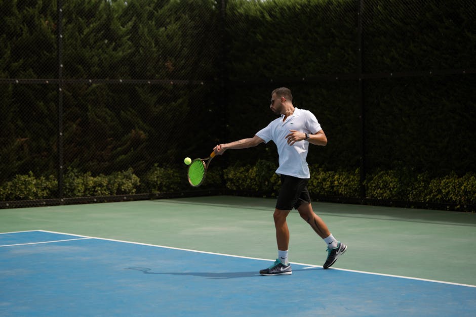 Left-handed athlete playing tennis in action