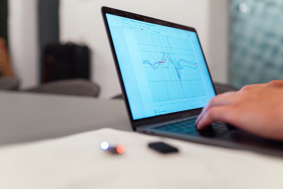 Scientist analyzing data on a computer with charts and statistics