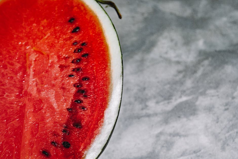 Close-up of wet watermelon slice on a clean surface