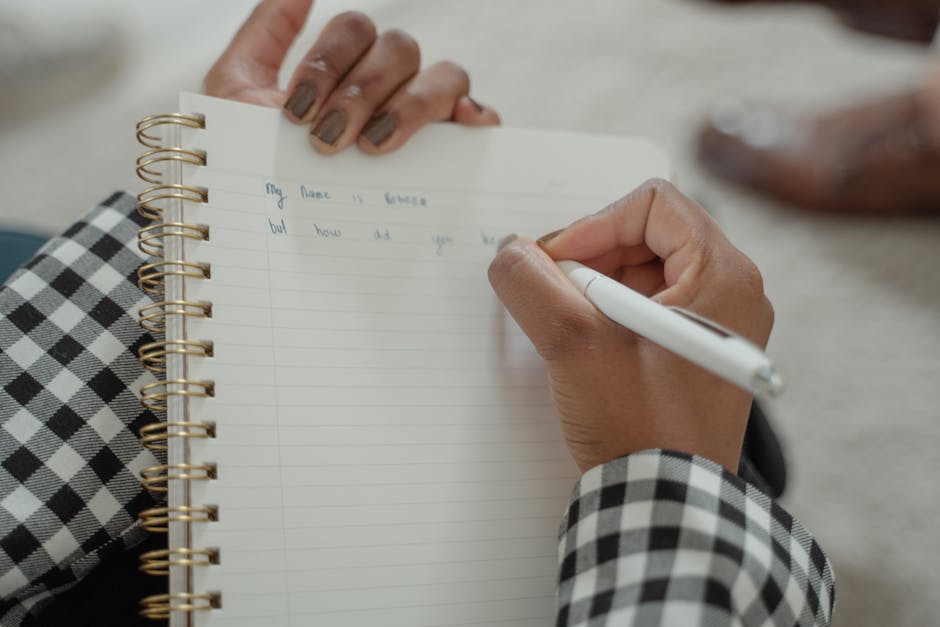 Comparison of left-handed and right-handed hands writing on paper