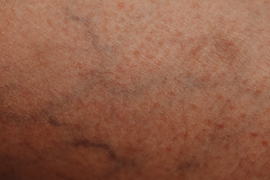Close-up of a human forearm with visible superficial veins under natural light