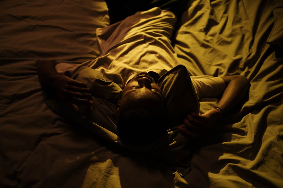 Postman waking up startled in bed, anxious nighttime scene