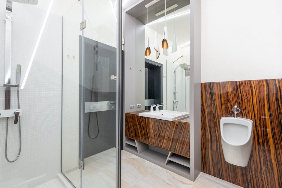 Glass of clear to pale yellow urine on a clean bathroom background