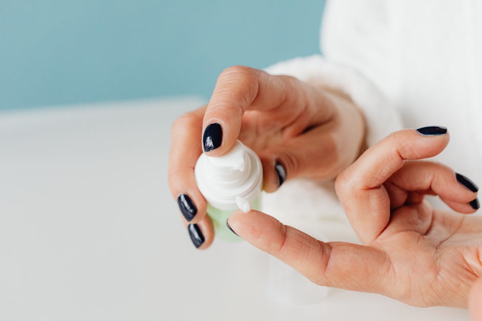 Close-up of dry irritated hands with skincare cream