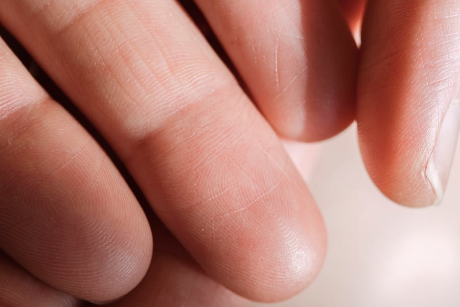 Fingerprint patterns on a fingertip close-up