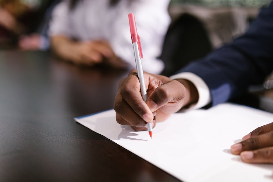 Left-handed person using scissors designed for right-handed users