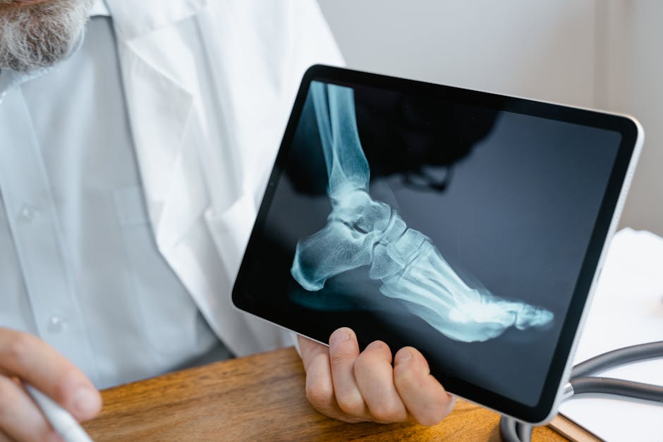 Human femur bone close-up on a neutral background