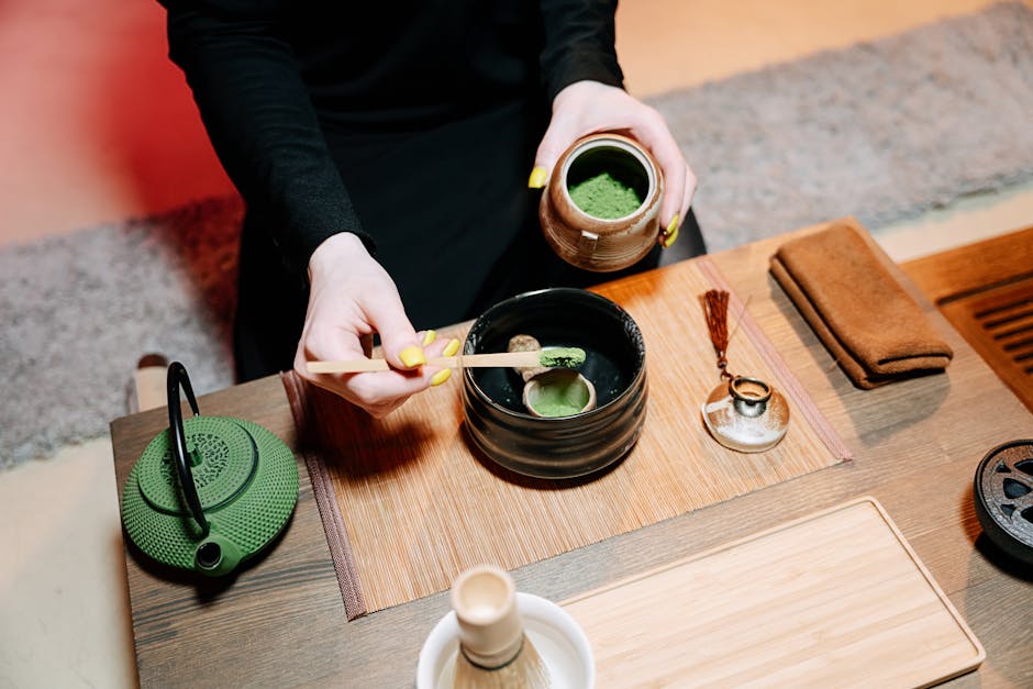 Matcha green tea powder and whisk in a minimalist setting