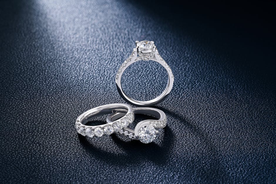 Jeweler inspecting a diamond ring setting and prongs