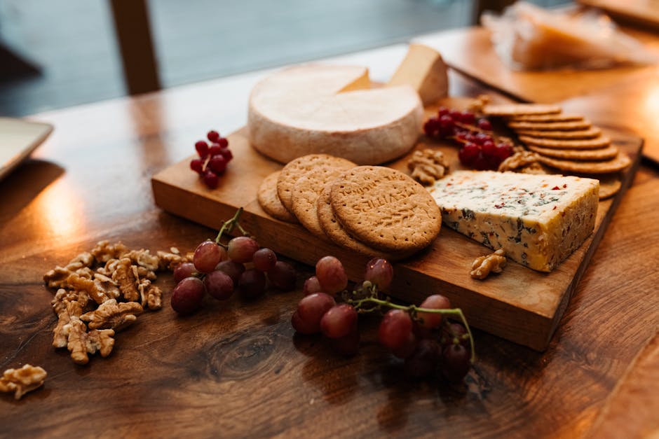 Late night snack with cheese, wine and dessert on a table