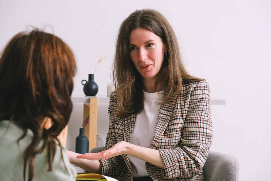 Doctor or therapist using humor with a patient in a supportive setting