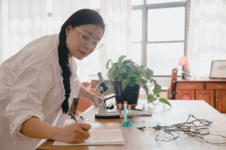 Scientific researcher analyzing fish samples in a laboratory aquarium