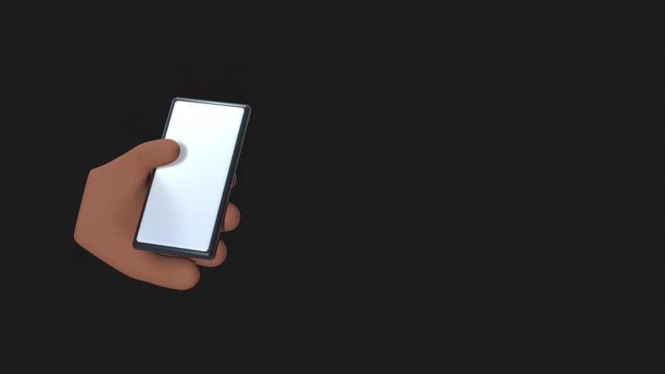 Close-up of a smartphone emitting wireless signal in a dark background