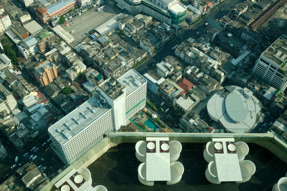 Balcony or rooftop edge overlooking a busy street below